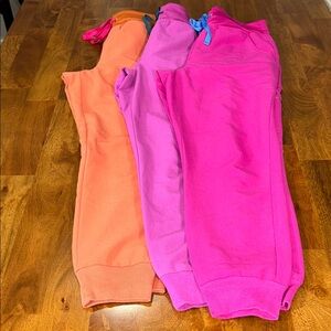 Figs Women's Track Pants in Orange, Pink, and Purple